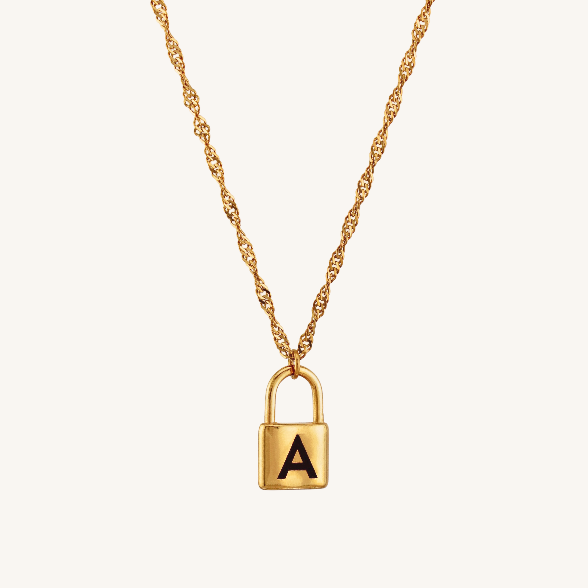 Gold necklace with a lock-shaped pendant featuring the letter 'A' on a white background