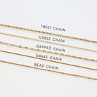 Gold chains with labels on a white background