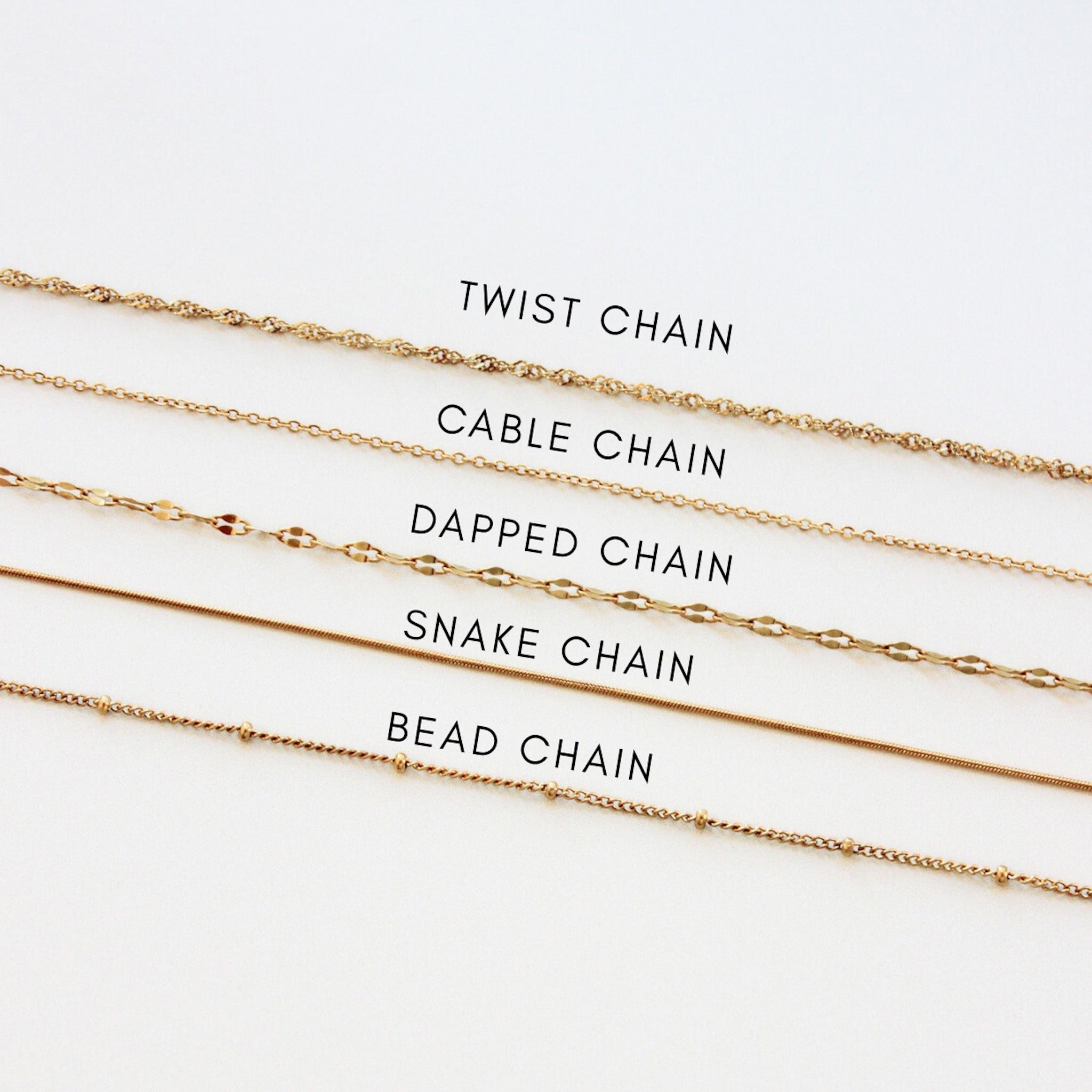 Gold chains with labels on a white background