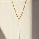 Gold chain necklace on a white background