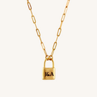 Gold necklace with a lock-shaped pendant on a white background
